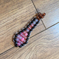 Beaded keychain/fidgit on a wooden floor