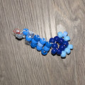 Blue beads on a wooden surface