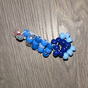 Blue beads on a wooden surface